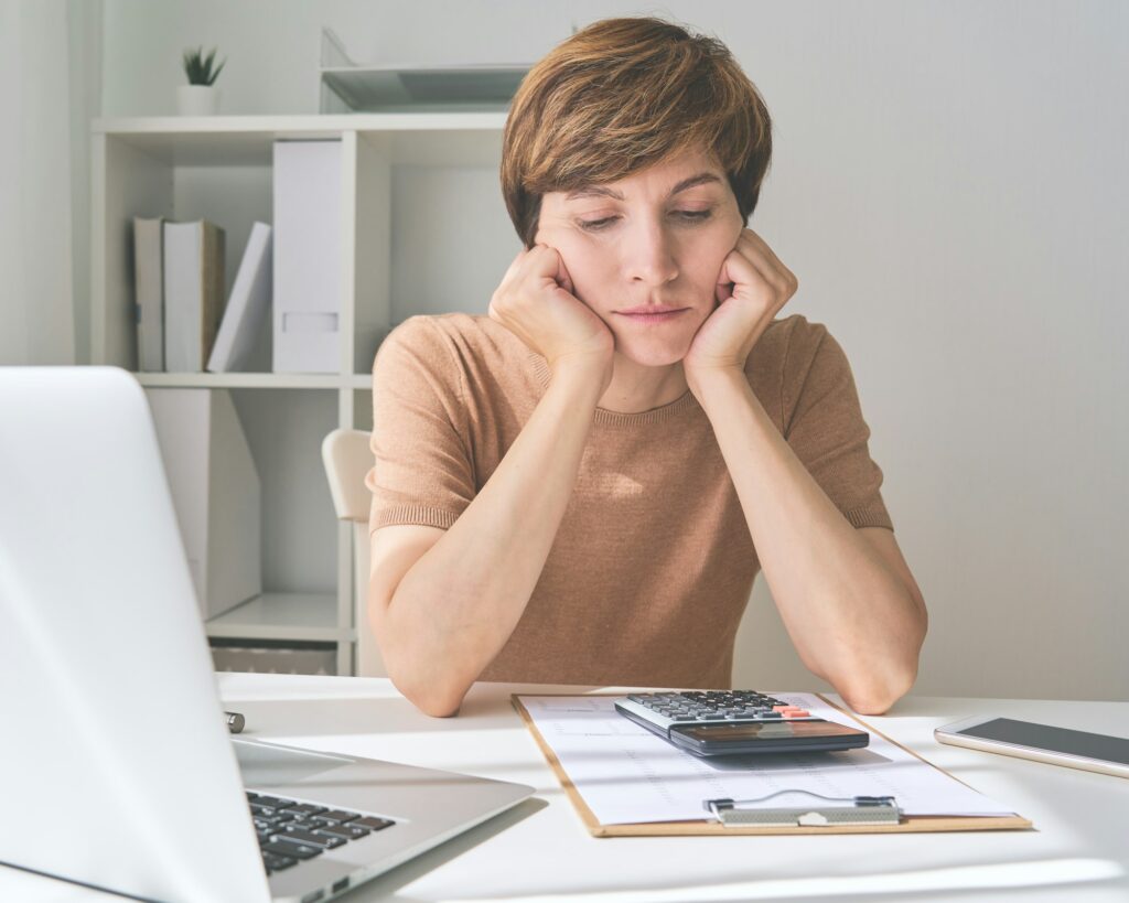 Caucasian woman planning paying bills and saving money. Spending wisely when prices increasing